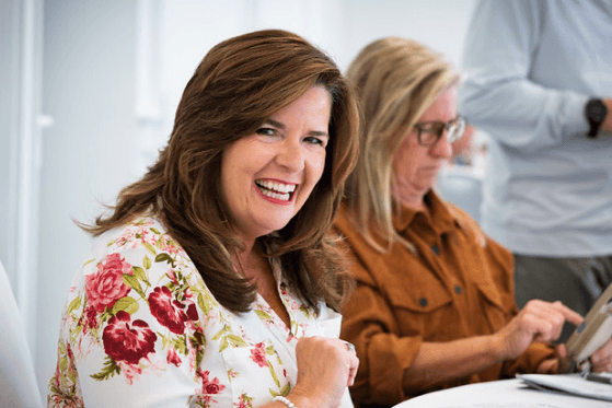 two women sitting at a table