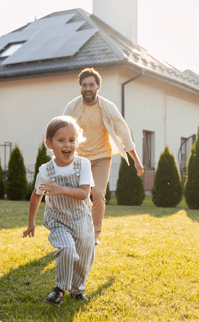father playing with his child in the yard