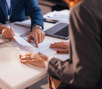 two people reviewing documents