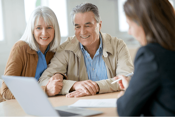 people reviewing documents at a table